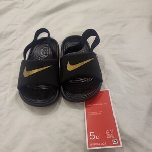 Nike Kids Black and Gold Slide Sandals